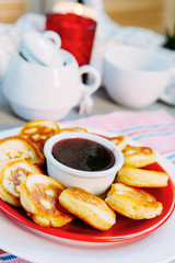 Tasty baked pancakes with strawberry jam