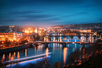 Draagtas Prague cityscape at night. Aerial view of the bridges on the Vltava river © rangizzz