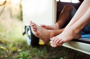 A group of young friends on a roadtrip through countryside.