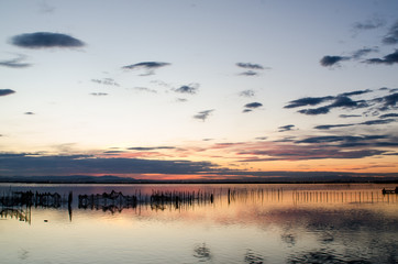 Obraz na płótnie Canvas Orange sunset on the lake of the Albufera in Valencia, Spain