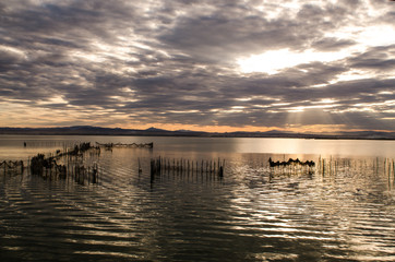 Fototapeta premium Sunset on one day cloudy in the famous lake of the albufera of Valencia, Spain
