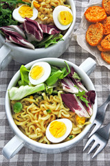 Noodle soup with greens and quail eggs. Flat Lay. Vegan Fitness Lunch.