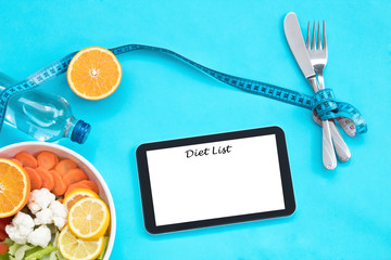 healthy eating, dieting, slimming and weigh loss concept - close up of diet plan on tablet pc screen.