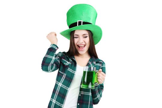 St. Patrick's Day. Beautiful woman wearing green hat with beer on white background