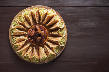 Arab sweets. Arabian pancake stuffed with sweet cheese and pistachios.