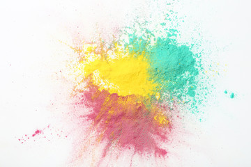 Colorful holi powders on white background