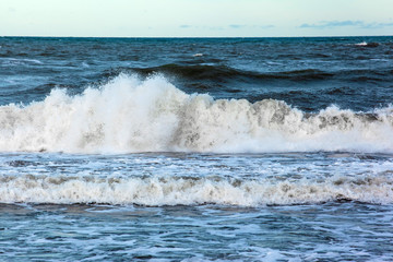 sea surface to horizon with big waves with foam and splashes