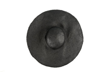 A black straw hat is a brimmed woman summer hat isolated on white background. Luxurious summer clothing item concept. 50's/60's Ladies Straw Sun Hat 'Bardot' Style, against headstroke. Flat lay view.