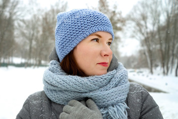 Portrait of adult woman outdoors in winter park