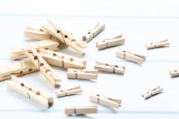 Brown clothespins on wooden table