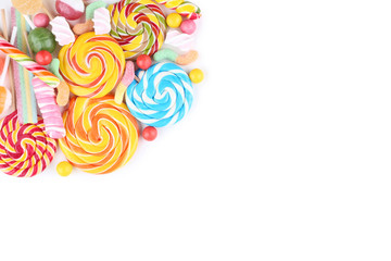 Sweet candies and lollipops on white background