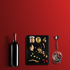 Mulled wine recipe ingredients and kitchen accessories, bottle of red wine, cinnamon, anise stars,...
