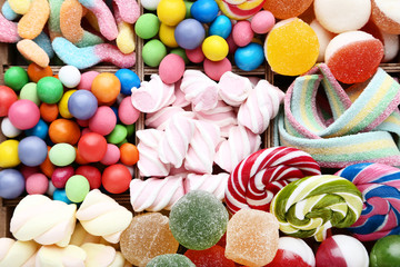 Fototapeta na wymiar Background of sweet candies and lollipops