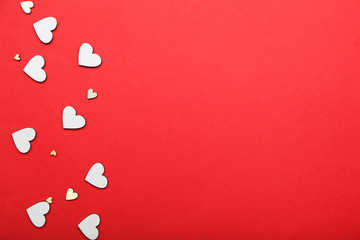 White valentine hearts on red background