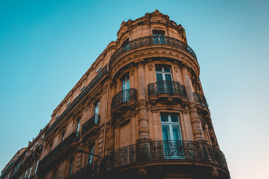 historical corner building with ancient orange facade