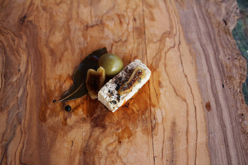 White cheese with figs with pickled cherry  tomatoes