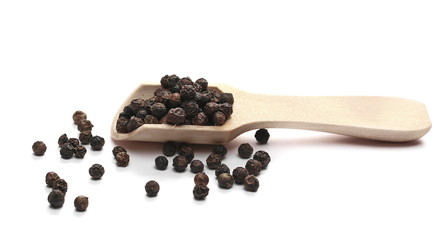 Black pepper, peppercorn in wooden spoon isolated on white background