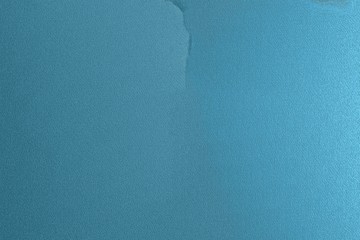 Blue wall texture with a crack in the middle