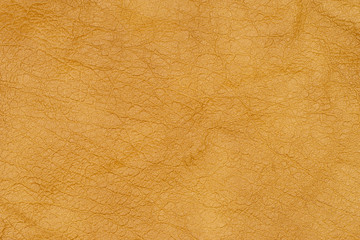 Brown or orange textured leather background. Abstract leather texture. 