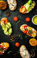 Assorted bruschetta with cheese, lemon, tuna, salmon and vegetables