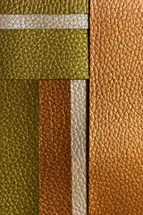 Shiny golden colour leather bright background. Geometric shapes. Brillante superficie backdrop.