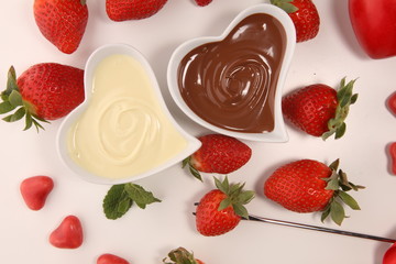 Valentine Chocolate fondue melted with fresh strawberries and dark and white chocolate. Tublips and sugar hearts.