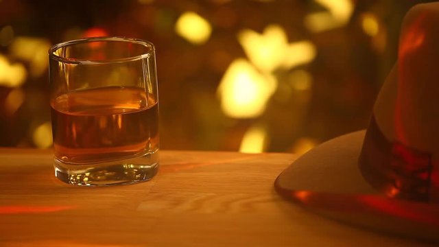 piano whiskey glass vintage hat wooden table gold bokeh smoke hd footage 