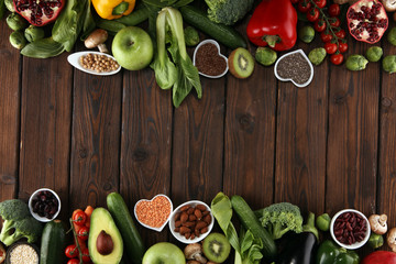 Healthy food clean eating selection. fruit, vegetable, seeds, superfood, cereals, leaf vegetable on rustic background
