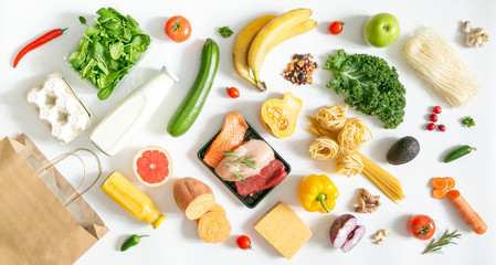 Grocery shopping concept - meat, fish, fruits and vegetables with shopping bag, top view