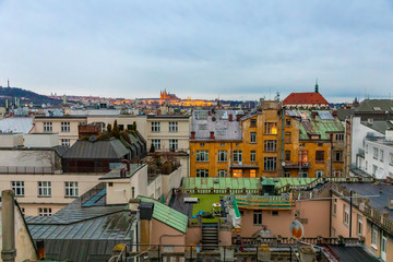 Fototapeta na wymiar View of Prague roofs and Prague castle from Palac Lucerna in evening