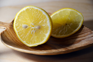 Lemon on a wooden plate