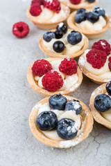 Homemade cakes with berries on  gray background close-up