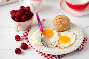 Breakfast  fried Eggs with buns and cheese