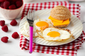 Breakfast  fried Eggs with buns and cheese