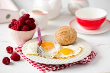 Breakfast  fried Eggs with buns and cheese