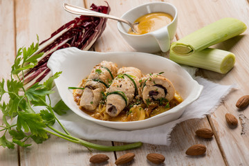 rolled up with leek mustard almond and red radish