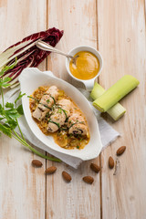 rolled up with leek mustard almond and red radish