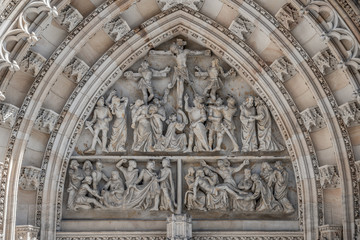Crucifixion of Christ scene at major entrance portal of Saint Vitus Cathedral in Prague, Czech...