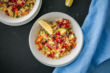 Healthy couscous with roasted vegetables on black background. top view, horizontal