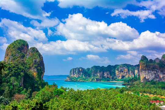 Railey beach, Krabi, Thailand: Beautiful overview over the palm trees with blue water and limestone cliffs