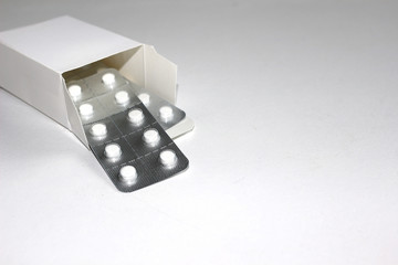 A Box of Medicine Pills on a White Background