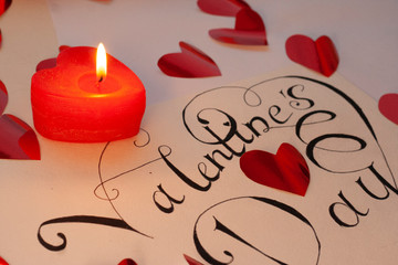 valentines day with heart and candle on red background