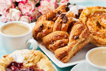 Fototapeta na wymiar Breakfast setup with Danish pastries and coffee
