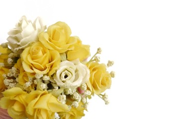 A female hand holding a bouquet of yellower roses flower on White isolated background 