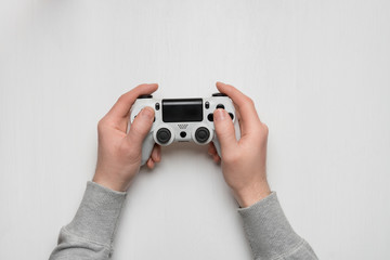 Hand hold new joystick isolated. Gamer play game with gamepad controller. Gaming man holding...