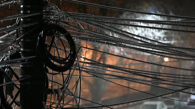 Electricity cables covered in ice after frozen rain phenomenon 