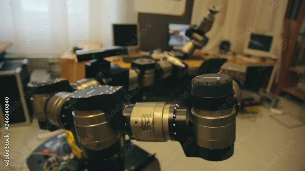 Poster close up view of a robotic device in a college science laboratory. engineering and technology univer