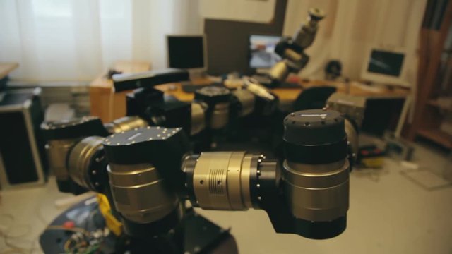 Close up view of a robotic device in a college science laboratory. Engineering and technology university studies in a lab environment focuses on science and technology.