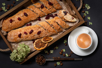 Studio shot of homemade cakes on a wooden tray  with a cup of coffee