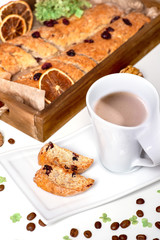 Fototapeta na wymiar studio shot of homemade cakes on a wooden tray with a cup of coffee
